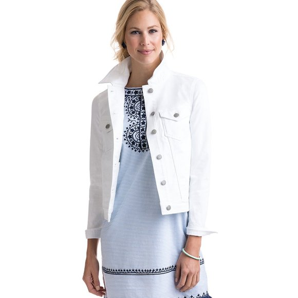 White women's denim jacket with ornate printed dress in Ace Cart store.
