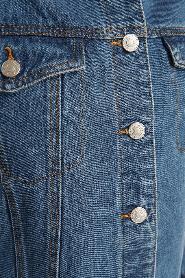 Denim jacket with metal buttons, classic jean style, casual fashion accessory for women