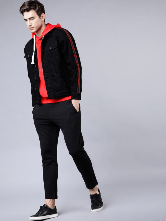 Stylish male model wearing black and red casual outfit
