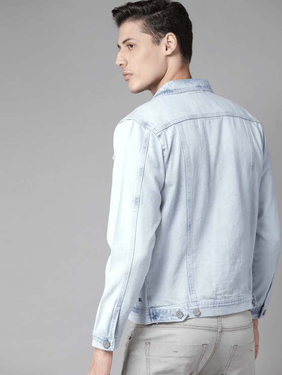 Stylish mens light blue denim jacket with classic collar and button closure, showcased against a plain grey background.