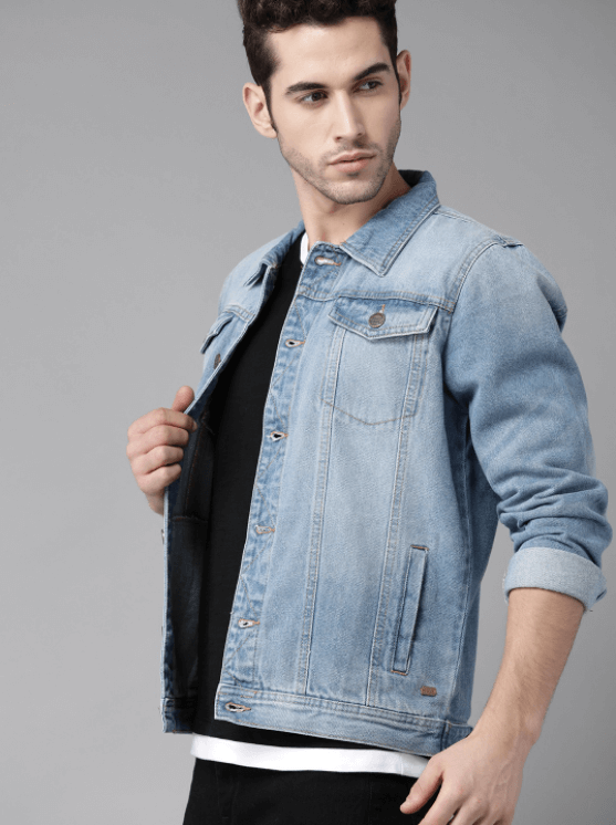 Light blue denim jacket worn by handsome male model with casual attire