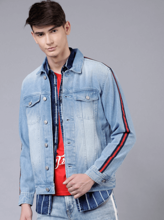 Light blue denim jacket with striped sleeve detail, worn by a young male model against a plain gray background.