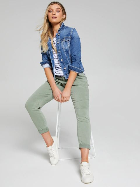Stylish model wearing a blue denim jacket, striped blouse, and olive green cargo pants. The image showcases the casual and fashionable outfit, featuring quality apparel products.