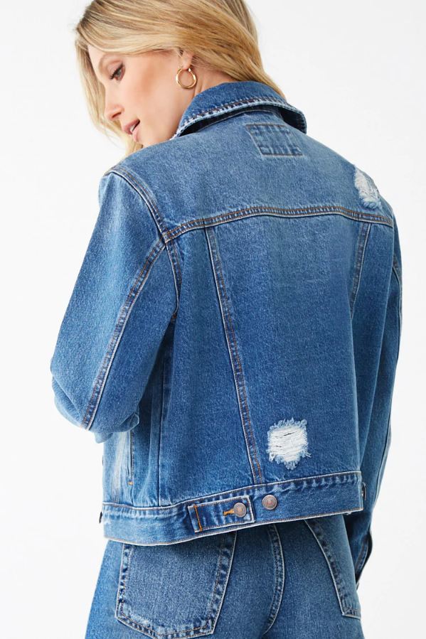 Distressed Women's Denim Jacket from Ace Cart featuring a classic blue color and a relaxed, cropped silhouette.