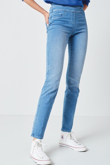 High-waisted slim-fit denim leggings with a soft stretch fabrication, displayed on a white background.