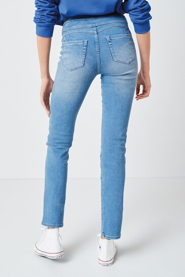 Soft sculpt pull-on slim fit jeggings with stretchy denim fabric in light blue color, shown against a plain white background.