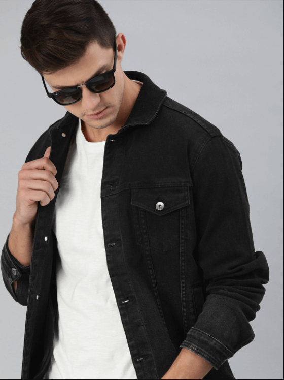 Stylish black denim jacket on a male model, featuring a casual and modern look.