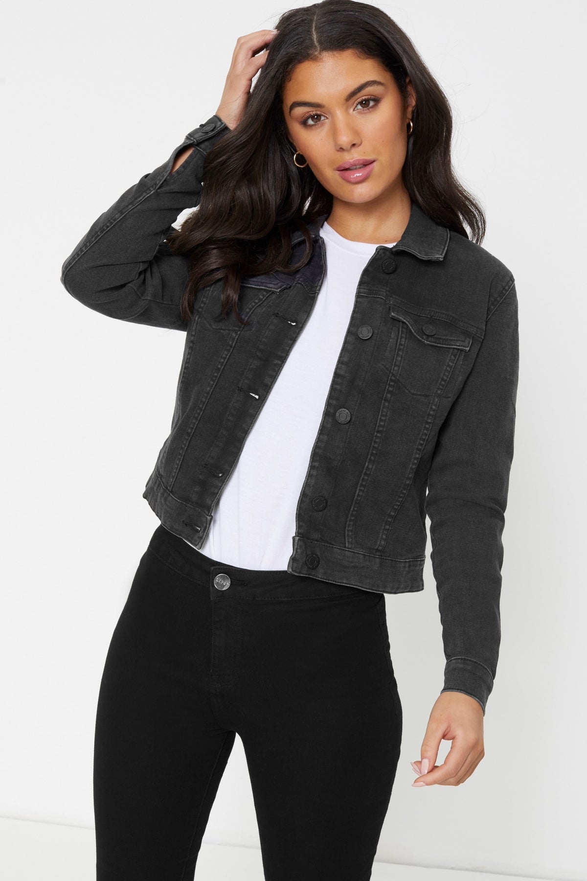 Stylish women's denim jacket in black, featuring button closure and classic look for casual wear.