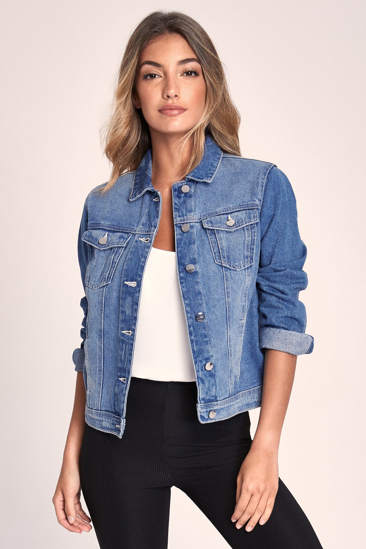 Stylish denim jacket for women, solid blue color, featuring a classic jean jacket design with button closures.