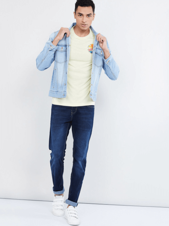Light blue denim jacket on casual young man against white background
