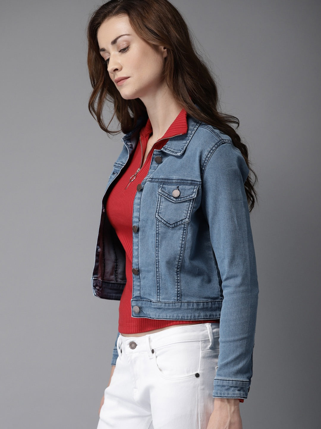 Woman's blue denim jacket, red top, white jeans