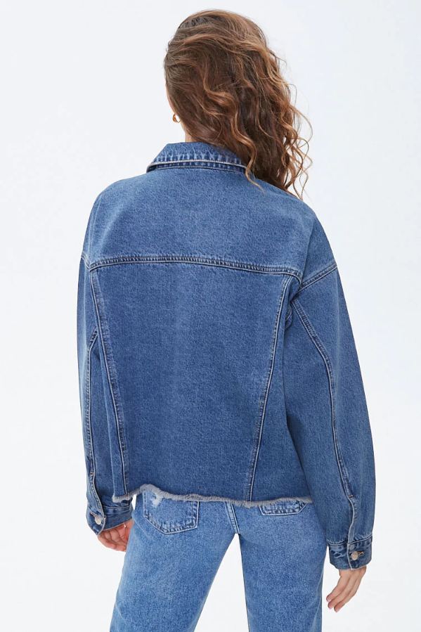 Frayed women's denim jacket with a relaxed fit, showcasing a casual style.
