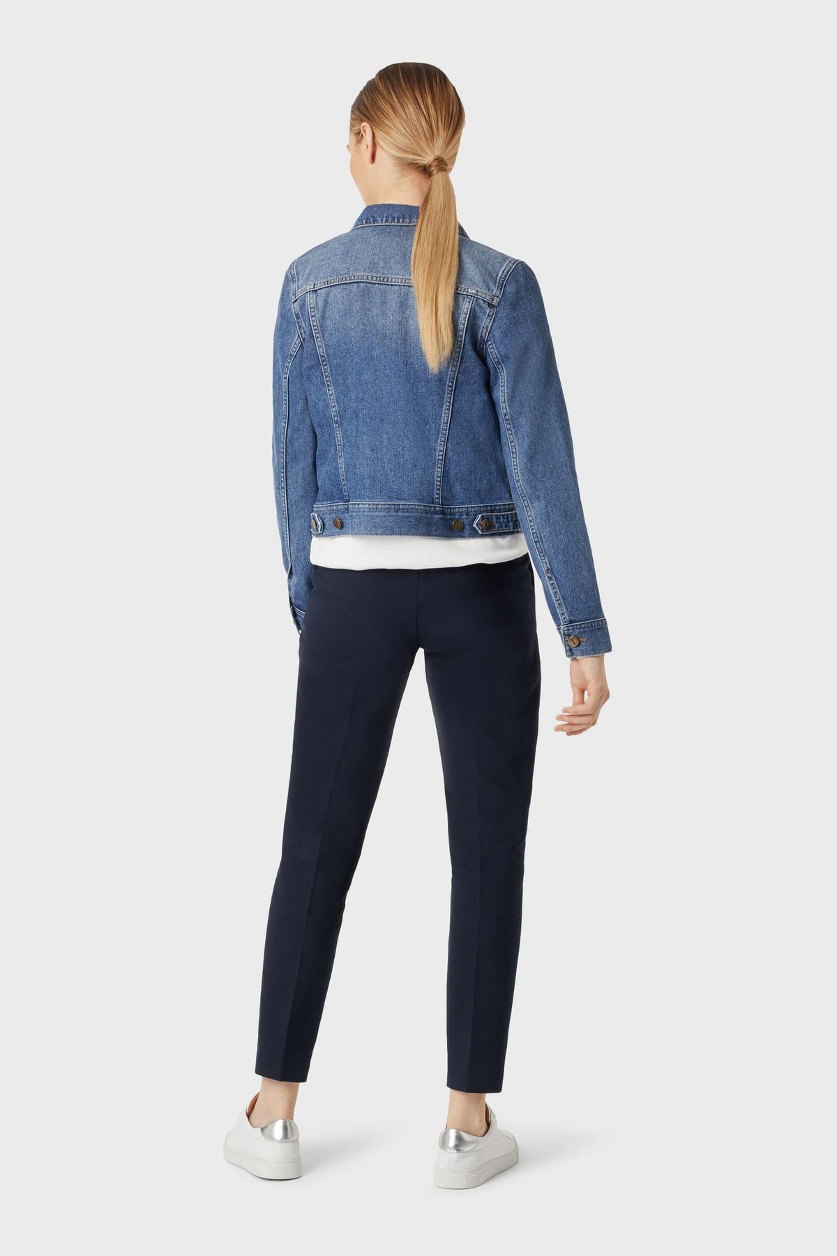 Stylish blue denim jacket for women, featuring a casual crop design with button closures.