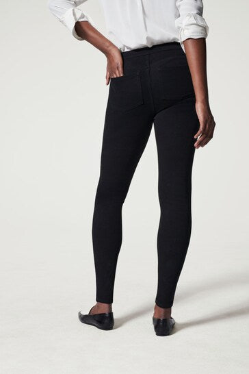 Stylish high-waisted black skinny jeggings with a sleek, flattering fit shown on a model in the product image.