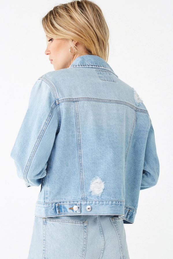 Women's light blue denim jacket with distressed details, shown on product placement against a white background.