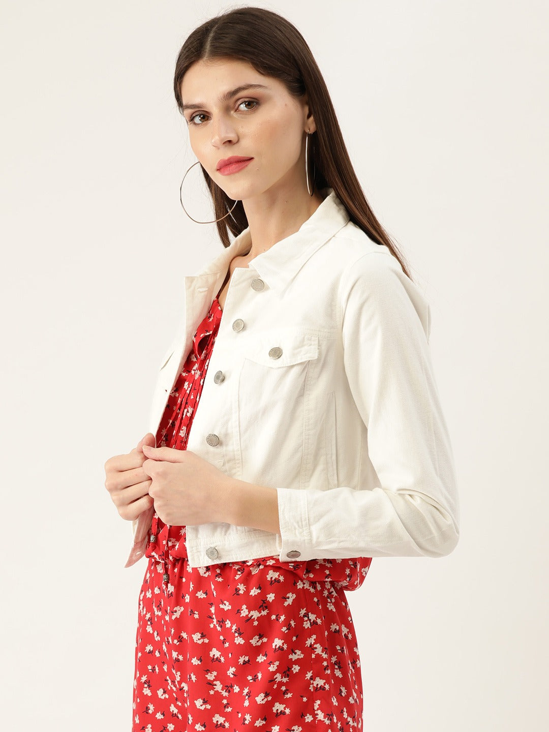 White solid crop jacket for women, featuring a fashionable and stylish denim design. The jacket is paired with a vibrant red floral patterned dress, creating a chic and trendy look.
