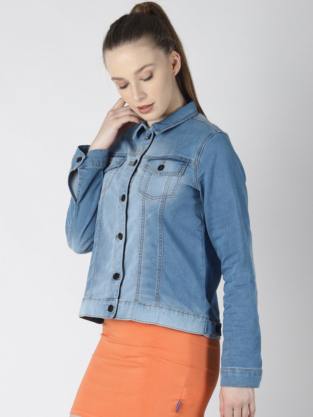 Blue denim jacket for stylish women, features button closure and long sleeves.