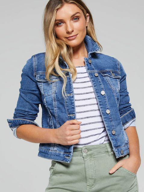 Stylish denim jacket for women, featuring a casual striped top and khaki pants in a studio setting.