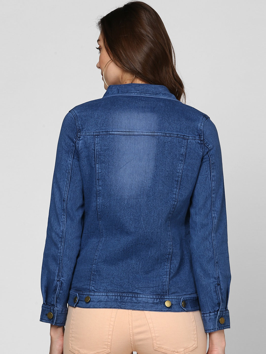 Stylish women's blue denim jacket on display