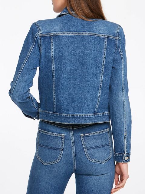 Denim jacket with classic silhouette, featuring a solid blue color and adjustable pockets for versatile styling. This cropped denim jacket from the Ace Cart brand offers a casual, trendy look for women.