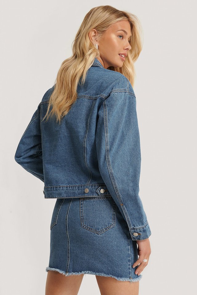 Stylish denim jacket for women, featuring a classic blue hue and a long sleeve design. The jacket has a structured silhouette and is perfect for casual outfits.