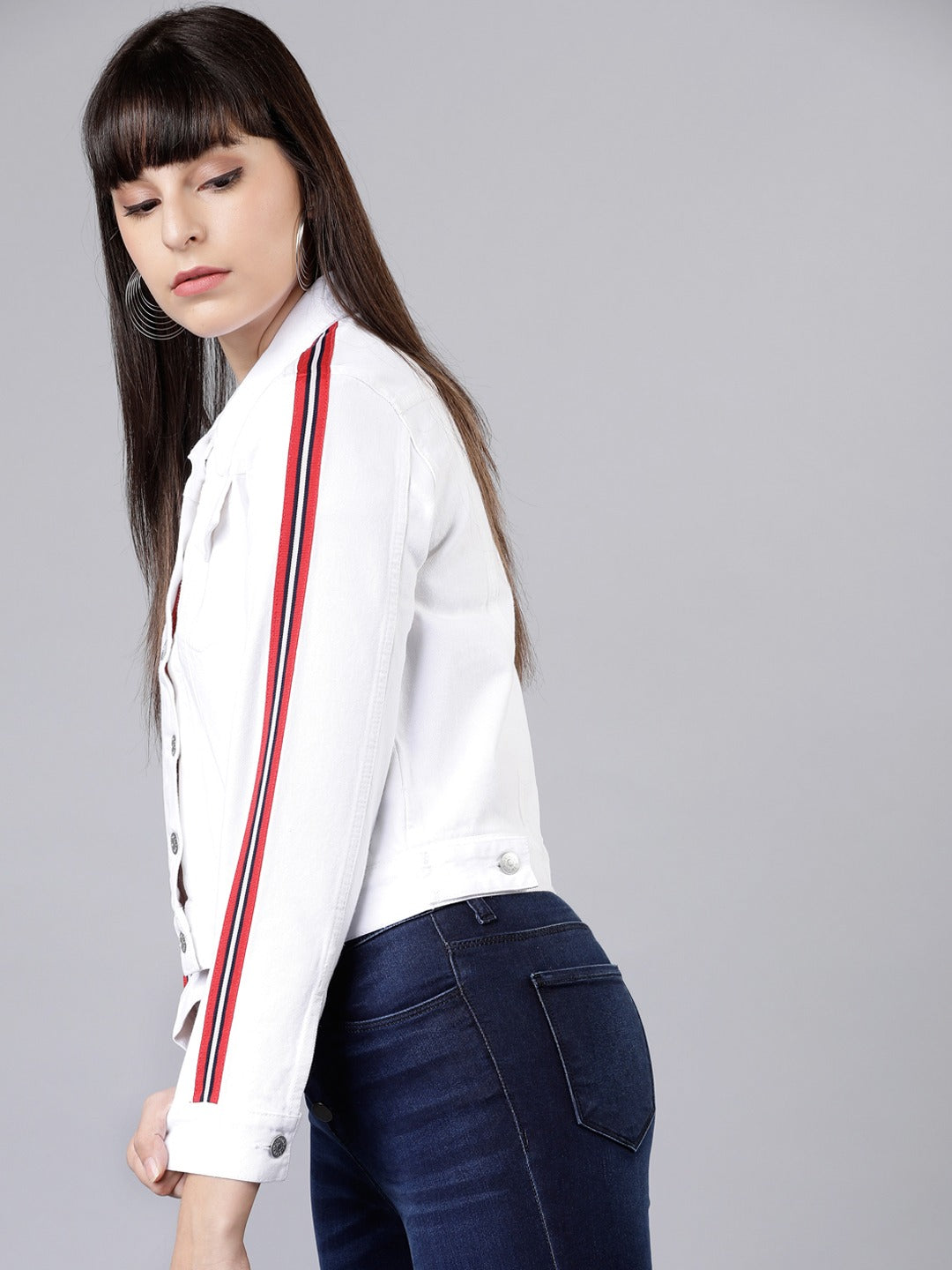 Stylish white women's jacket with red and blue striped trim, showcased against a gray background