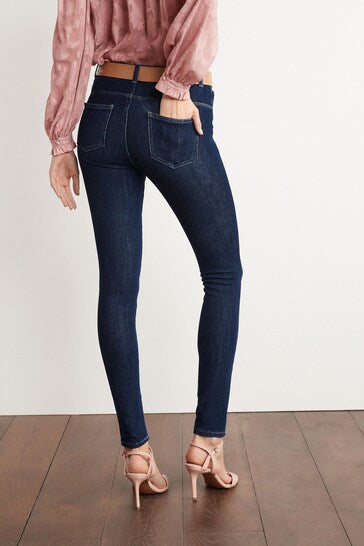 Slim-fit stretch denim jeans with elasticated waistband, perfect for casual or dressy looks.