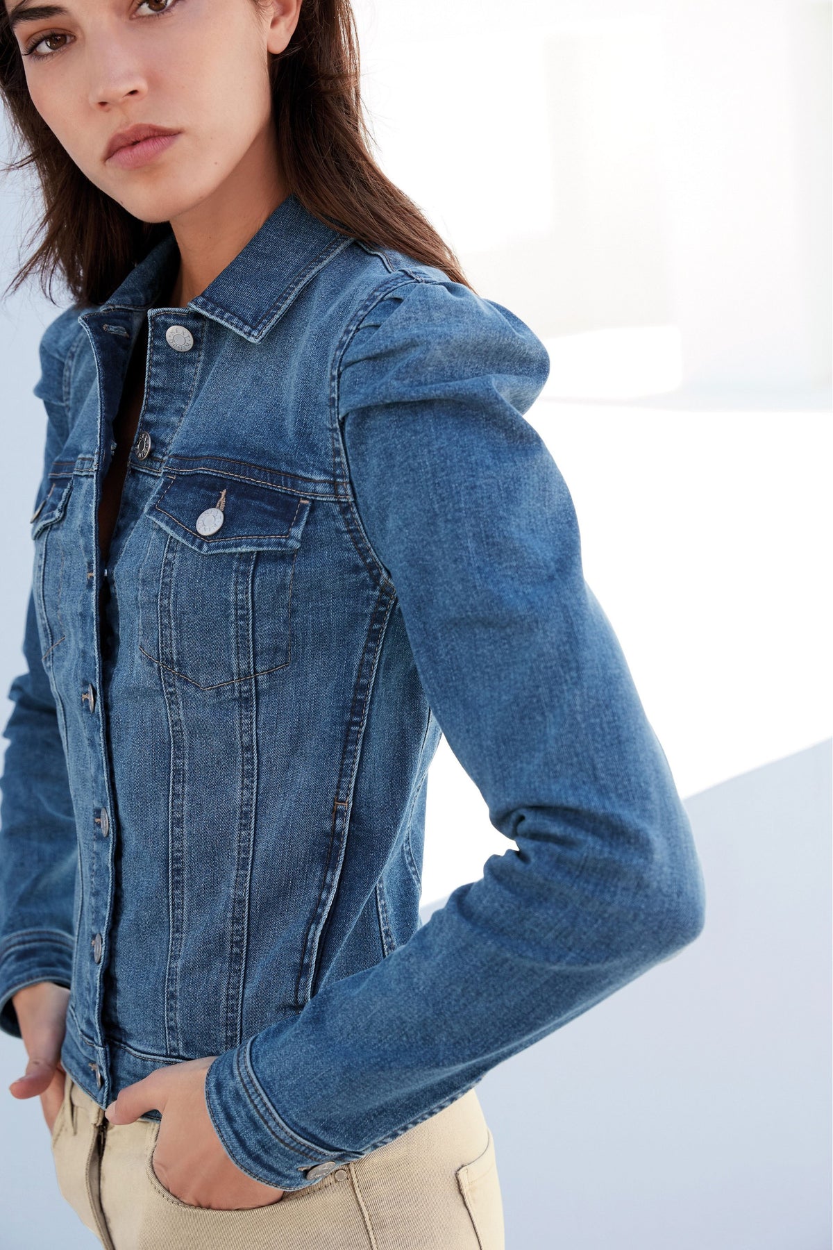 Stylish denim jacket with puff sleeves, perfect for a casual yet chic look.
