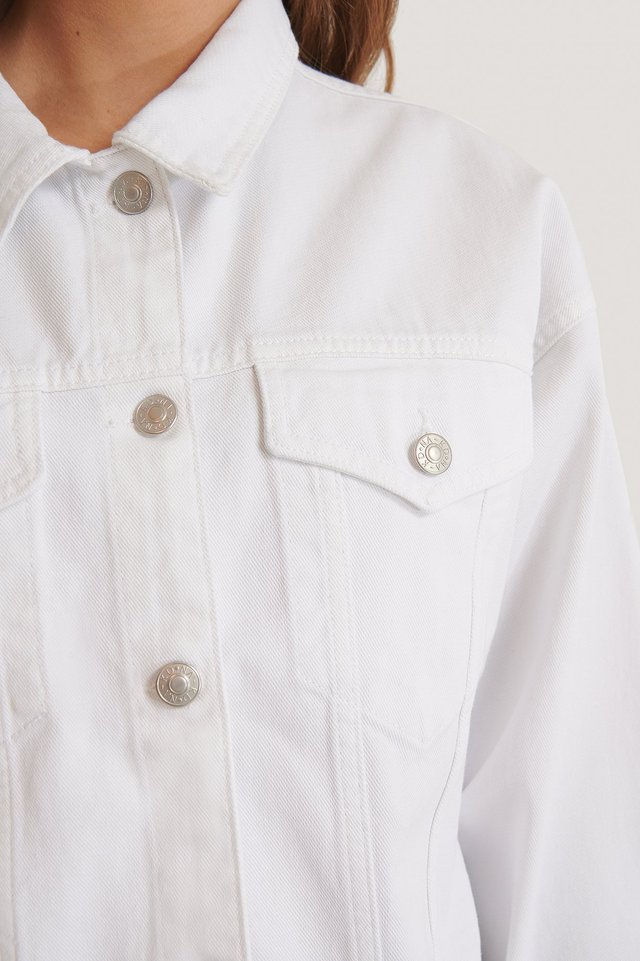 White Denim Jacket for Women
Crisp white denim jacket with silver button detailing, showcasing a casual yet stylish look.
