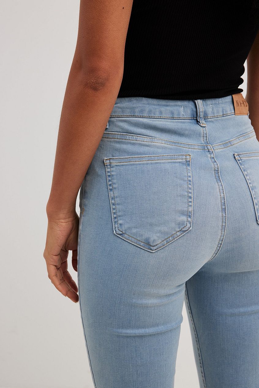 High-waisted light-wash flared denim jeans with front pockets