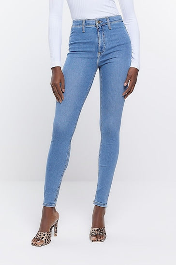 High-rise light blue denim jeggings with a slim, stretchy fit and distressed knee details from Ace Cart.