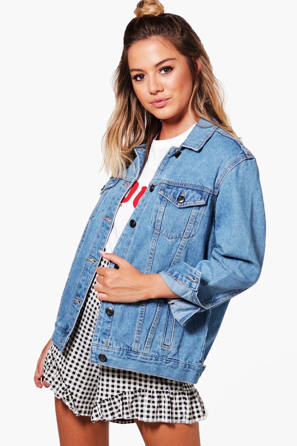 Stylish denim jacket for women, blue solid design with button closure, paired with a checkered mini skirt, creating a casual yet fashionable look.