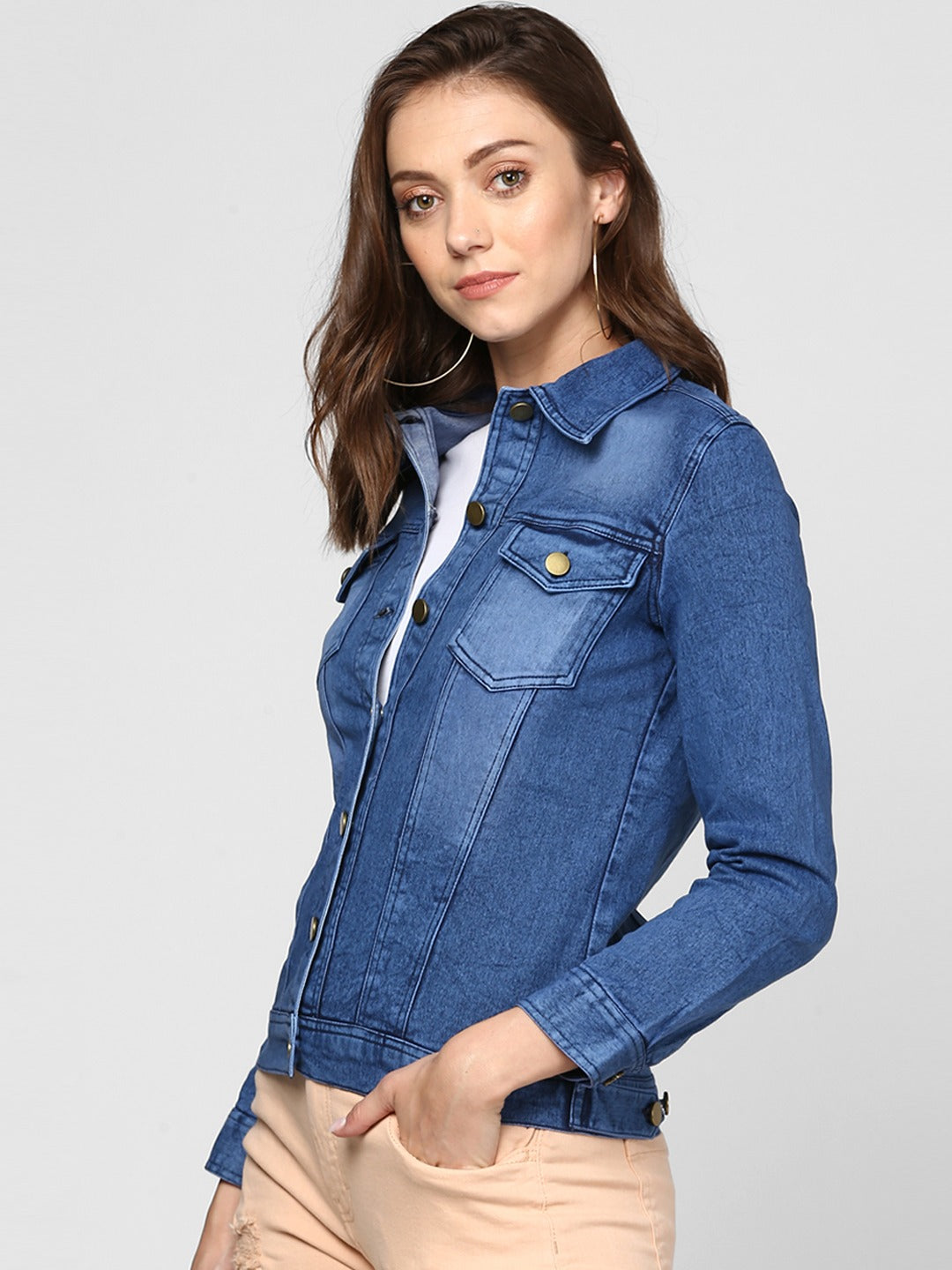 Stylish women's blue denim jacket with pockets, buttons, and collar for a trendy casual look.