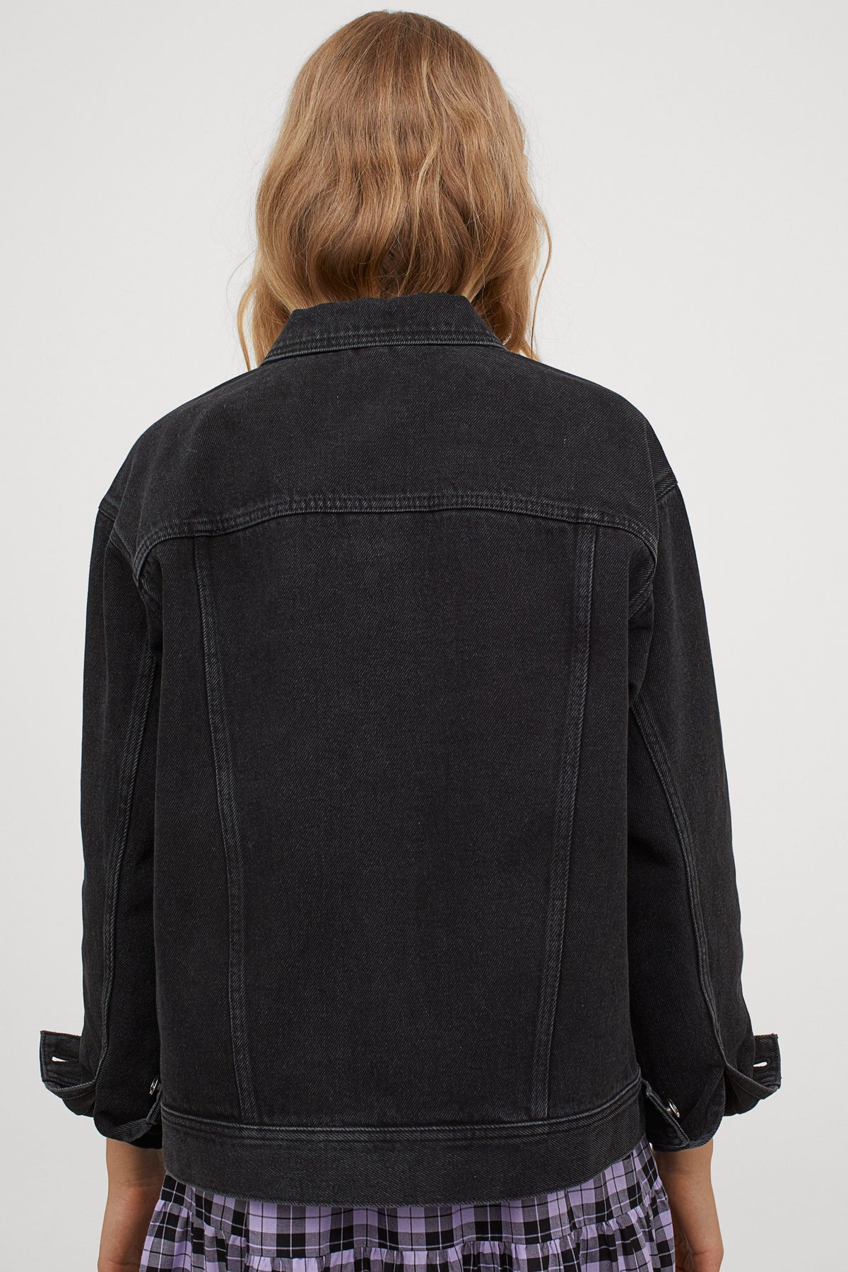 Relaxed fit black denim jacket from Ace Cart, featuring collar, chest pockets, and stone-washed finish.