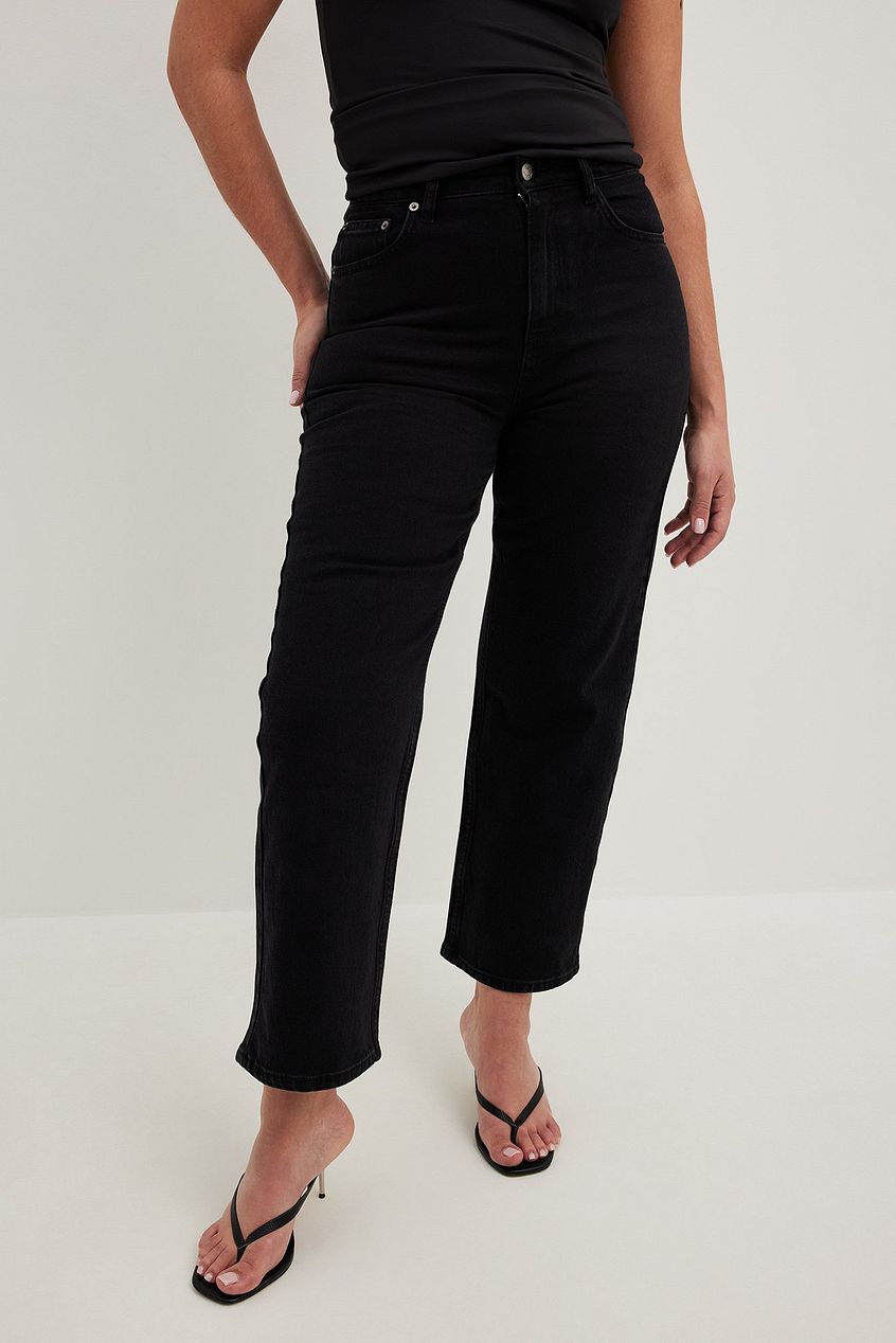 High-waist cropped black denim jeans with a straight, relaxed fit and minimal detailing showcased against a plain background.