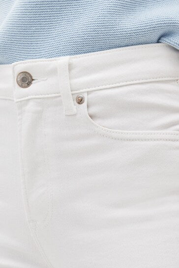 White high-waisted jeggings with button closure and detailed stitching from Ace Cart.