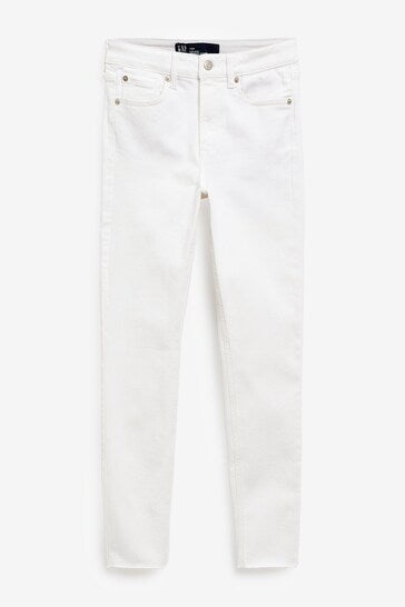 High-waisted white denim jeggings with distressed knee detail from Ace Cart.