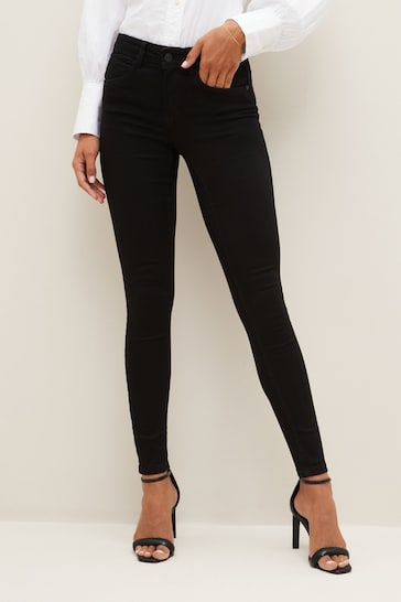 Sculpting Stretch Skinny Jeans by NOISY MAY - Sleek black high-waisted jeggings designed to flatter curves with a comfortable, smoothing fit.