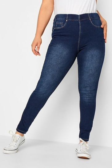 High-waisted stretch denim jeggings with ripped knee detail, versatile casual fashion for curvy women.
