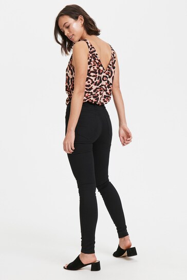 Sleek leopard print skinny jeggings with high waist, ripped knee design, and stretch fit for curvy women's fashion.