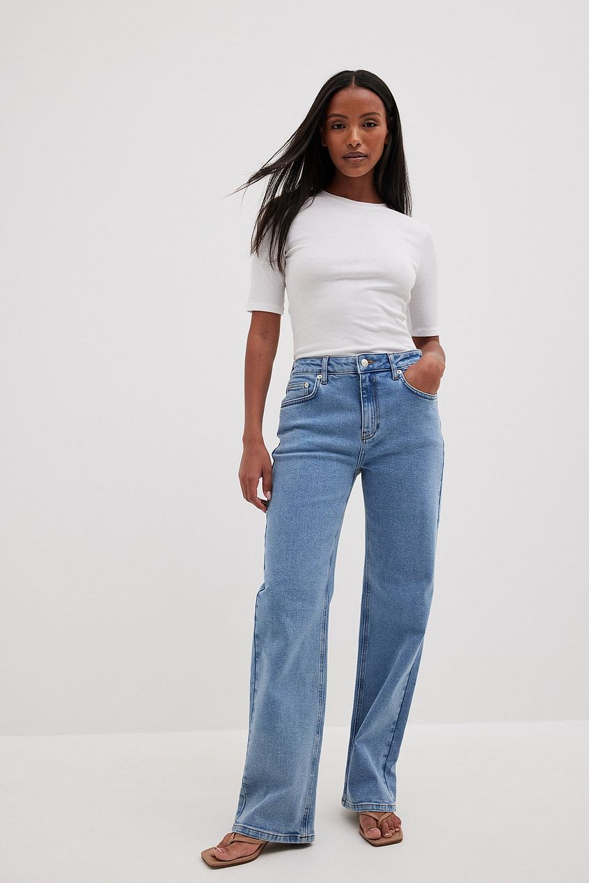 Mid-Waist Denim Jeans - Woman wearing light blue high-waisted straight leg jeans from Ace Cart's denim collection on white background