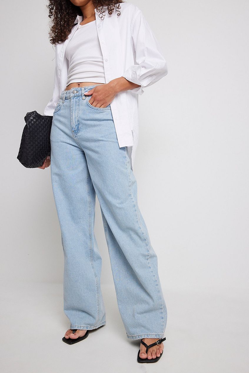 Organic Extra Wide Leg Denim: Stylish high-waist jeans with relaxed, flared legs, showcased in a white background.