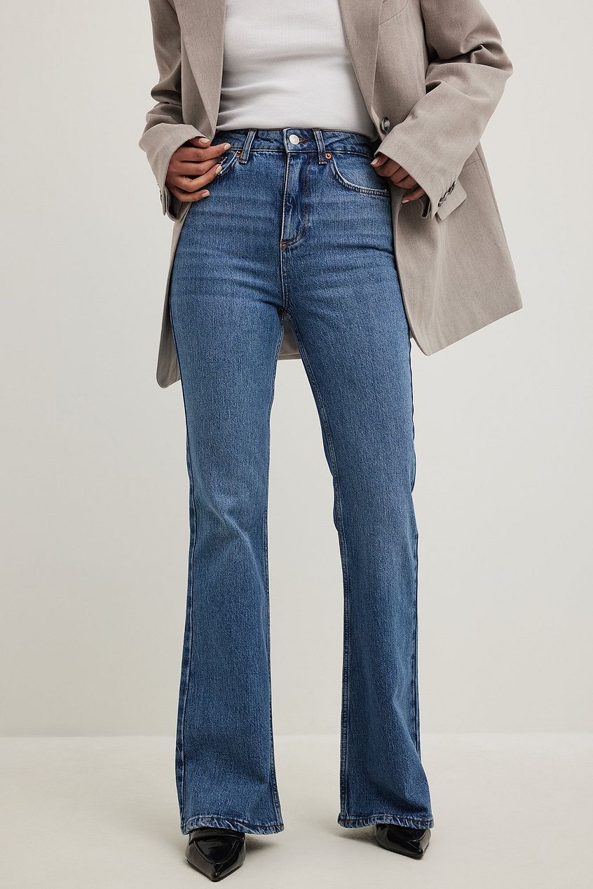Flared high-waist denim jeans with a relaxed fit, showcased against a plain background.