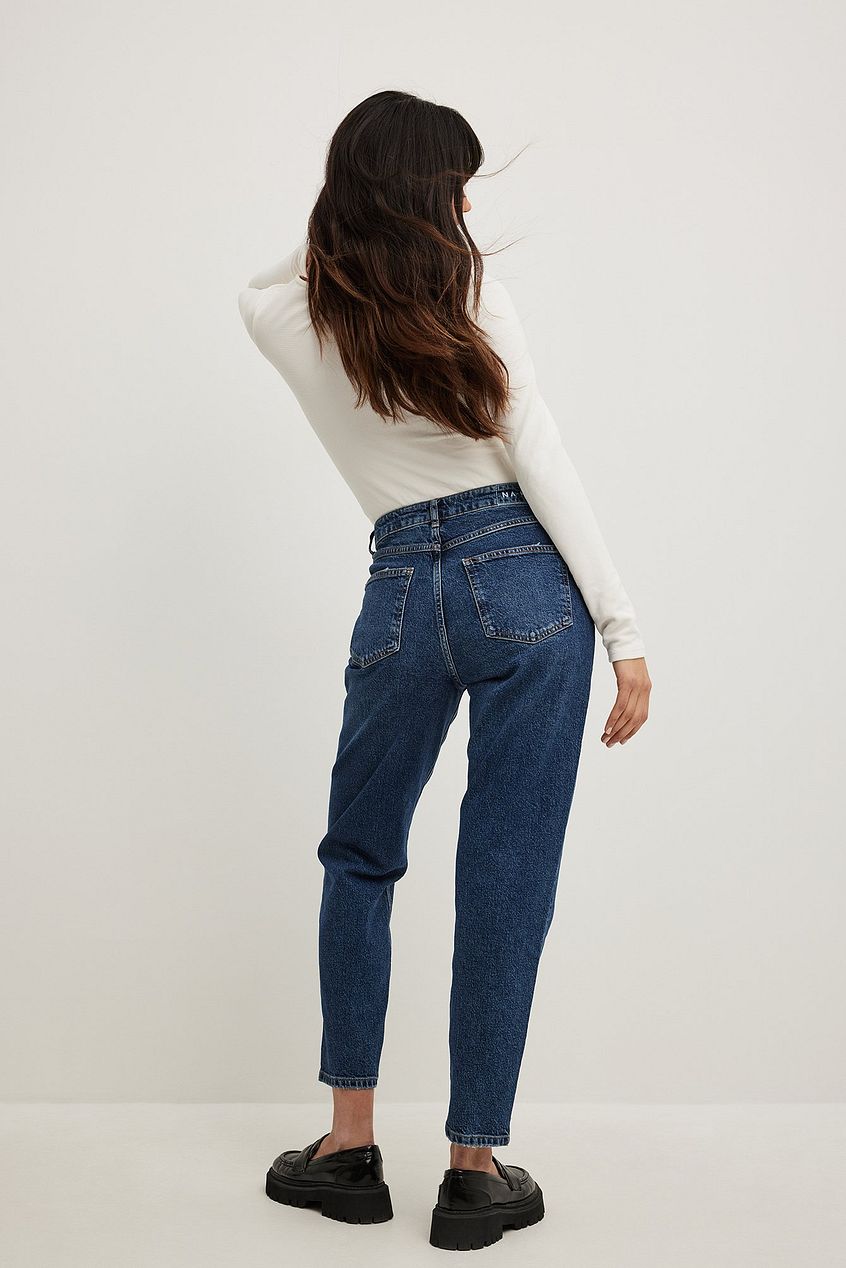 High-waisted denim jeans with figure-flattering straight-leg design, modeled against plain white background.