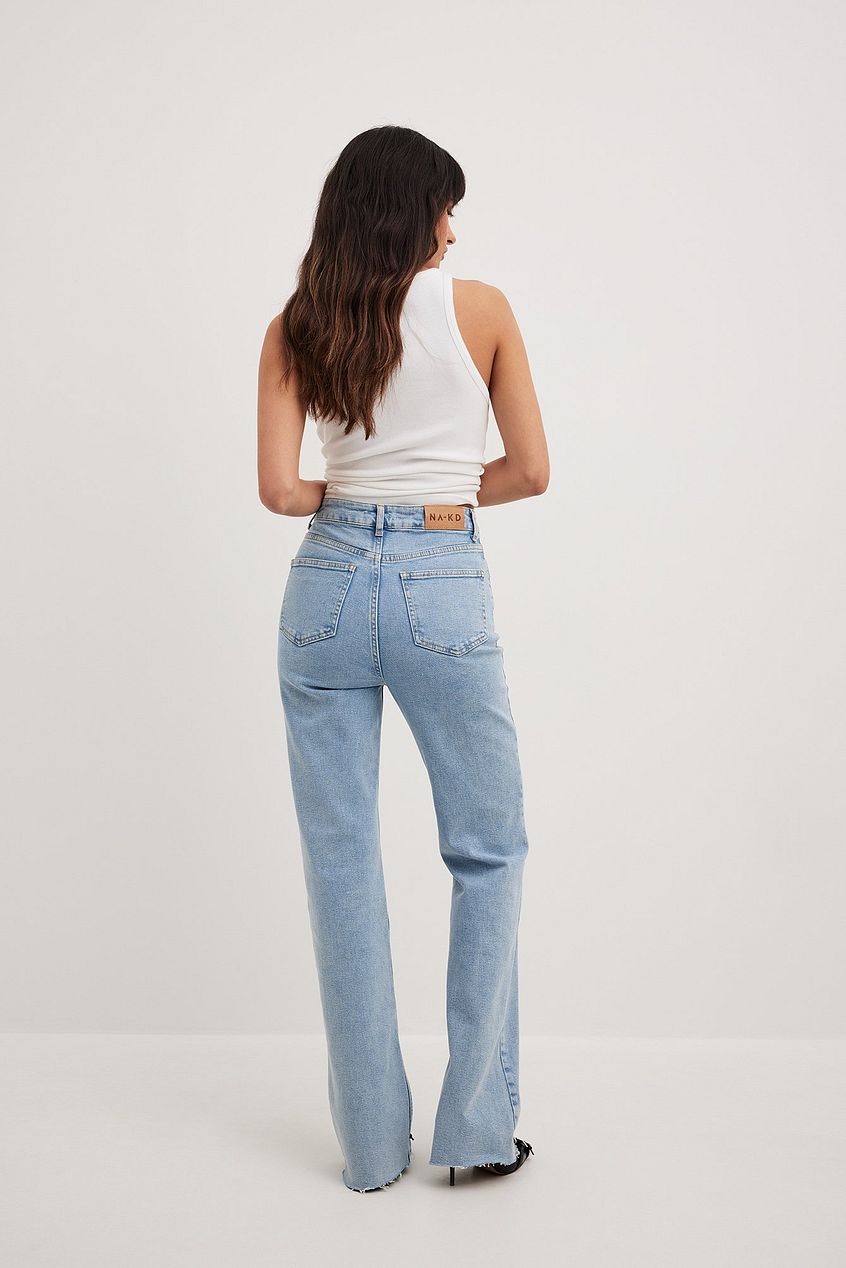 High-waisted flared jeans from Ace Cart, featuring a relaxed fit and classic denim style.