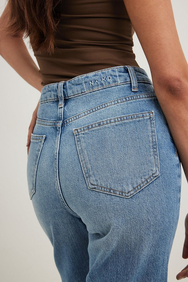 High-waist cropped straight-leg denim jeans from Ace Cart, featuring a classic blue wash and pockets.