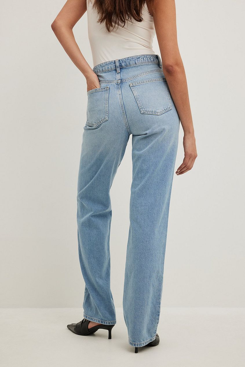 Straight high waist denim jeans with pockets displayed against a plain background.