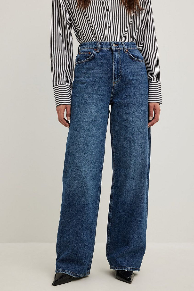 High-waisted denim jeans with relaxed fit and wide leg silhouette.