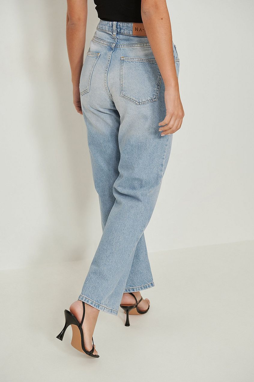 High-waist Relaxed Blue Jeans - Comfortable denim pants with a relaxed fit and high-waist design, showcasing a classic blue wash and subtle details.