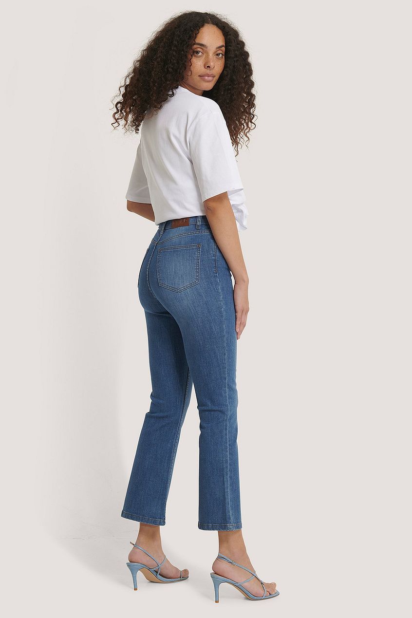 Kick Flare Skinny Jeans on model: High-waist denim jeans with flared leg design, relaxed fit, and slim silhouette.